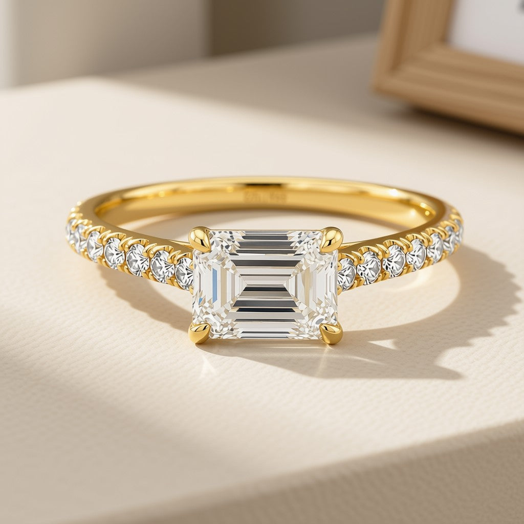 Emerald-cut diamond pavé ring in 14K yellow gold, front view
